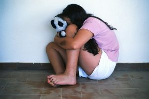 Child-abuse-Girl-Cowering-Against-a-Wall-829250-620x413
