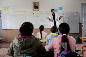 School children listen to their teacher as they study during a class in the Oudaya primary school in Rabat